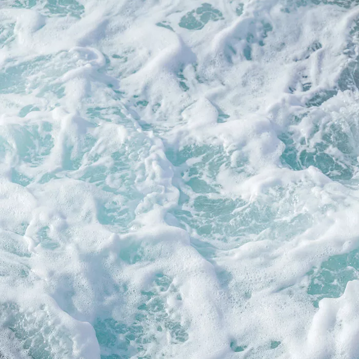 Waves on the beach of Patina Maldives