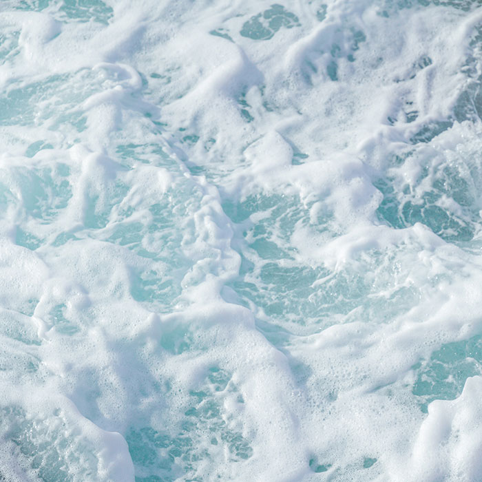 Waves on the beach of Patina Maldives