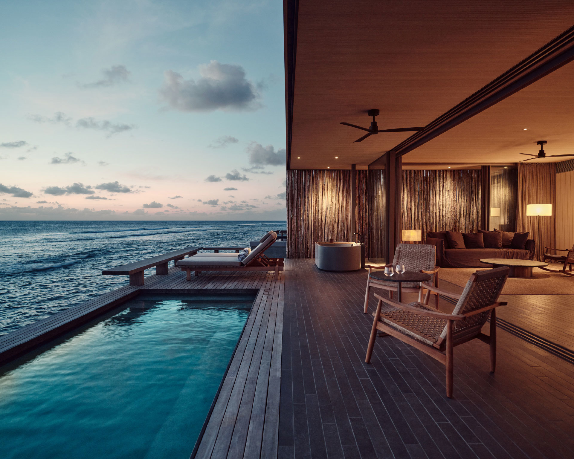 View of the sunset from the One Bedroom Water Pool Villa at Patina Maldives