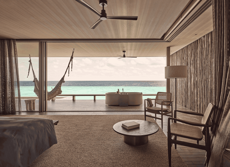 Cozy lounge opens to tropical patio.