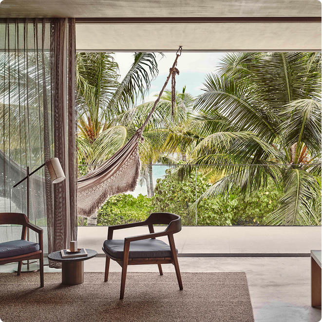 Cozy lounge opens to tropical patio.
