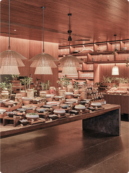 Warm-lit dining setup with woven lights