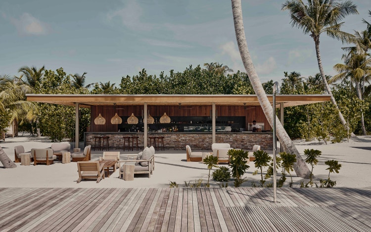 Modern beachside bar at Patina Maldives.