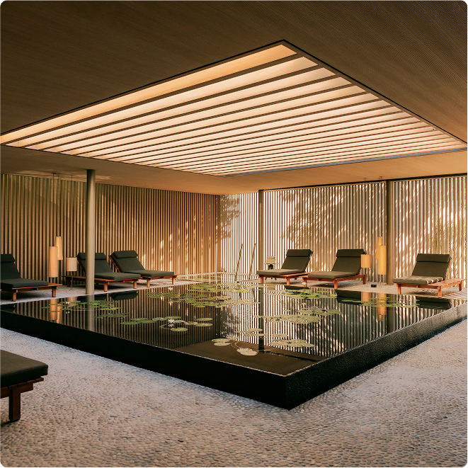 Cushioned seating in tranquil wellness space.