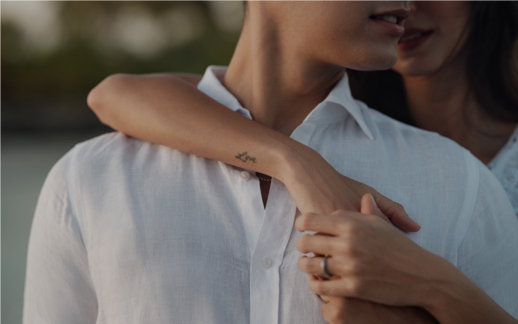 Arms wrapped gently in loving gesture.