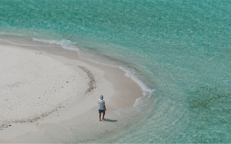 Guest observes tranquil ocean at Patina.