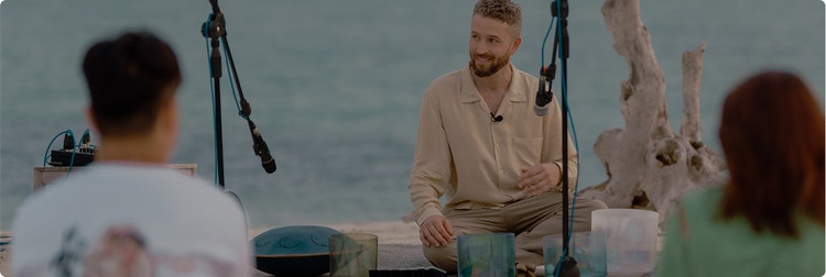 Guests attend oceanfront sound healing session
