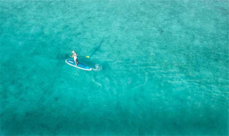 A guy on a boat in the ocean