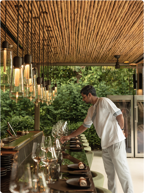 White-clad staff prepares dining counter