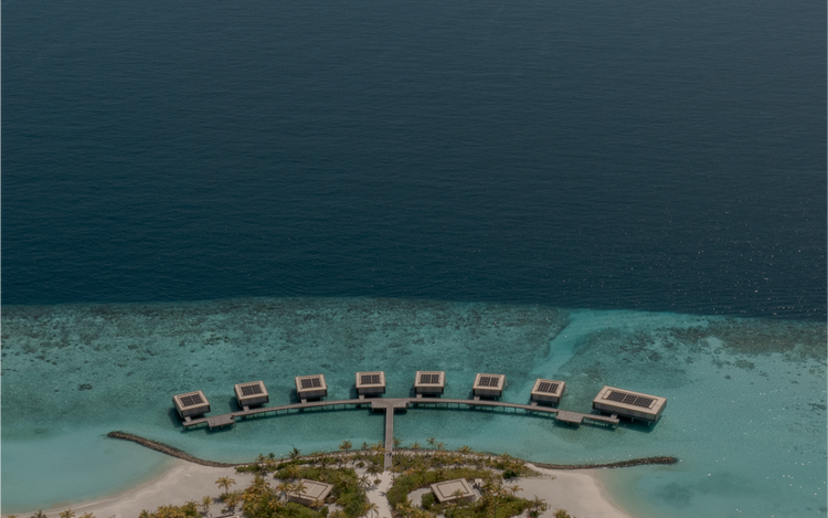 Tropical island resort with turquoise waters.