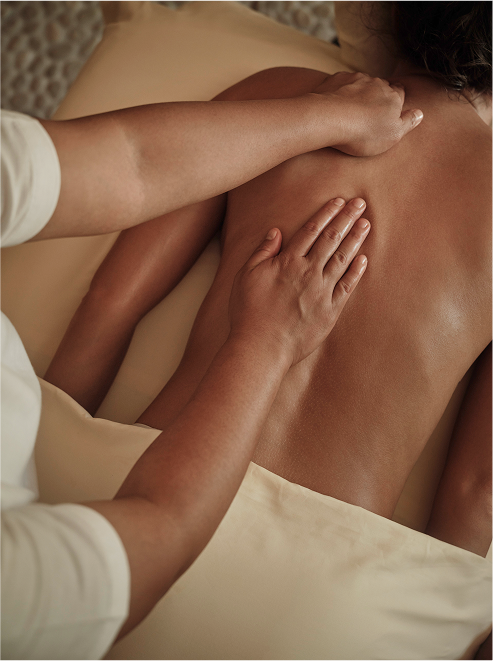 A person undergoing signature massages in soft tissue therapy