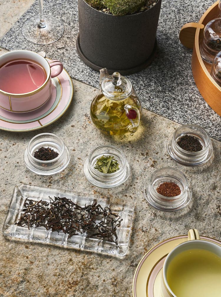 Ceramic teacups with leaf-shaped saucers.