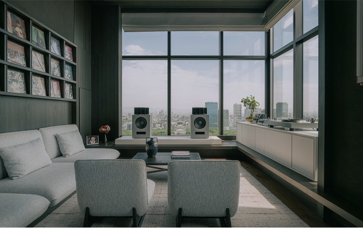Audiophile lounge with panoramic city view.