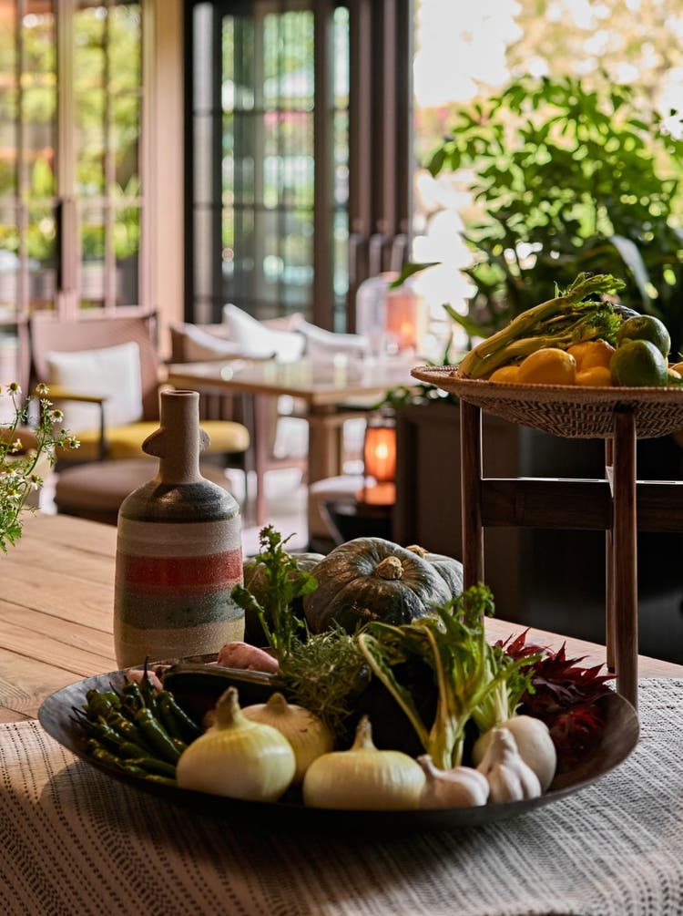 Roasted onion topped with truffle slices.