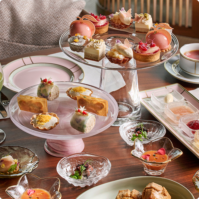 Tiered desserts with edible floral accents.