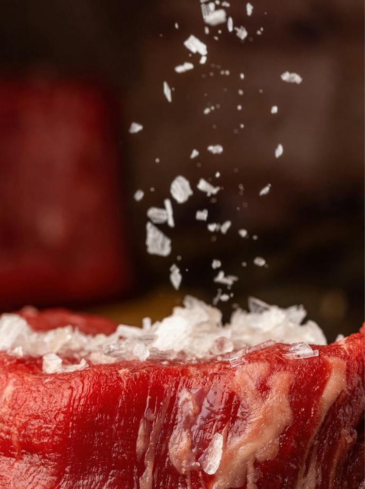 Raw steak prepared with falling crystals.