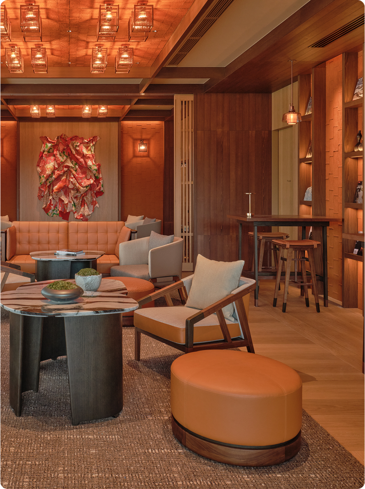 Warm-toned lounge with abstract wall art.