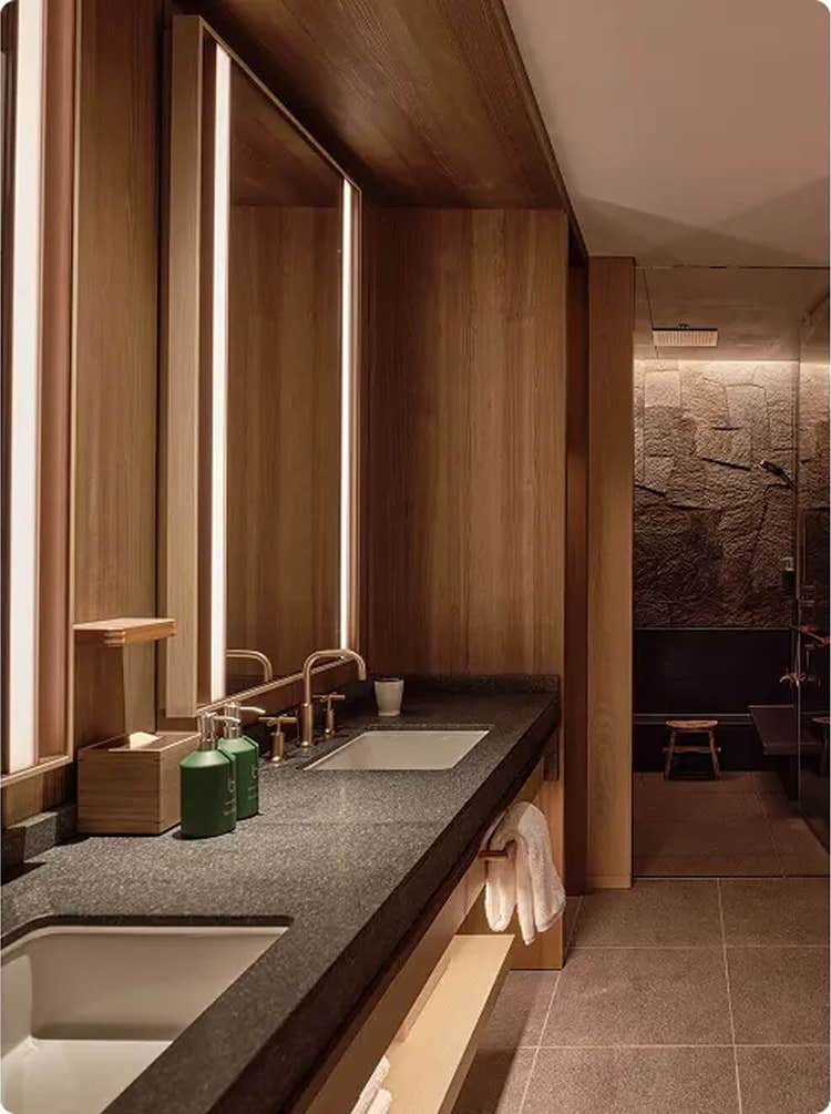 Twin sinks with warm wood accents.