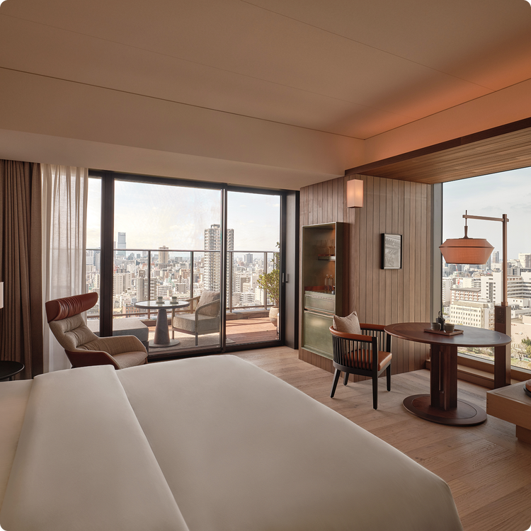 Spacious suite opens to skyline balcony.