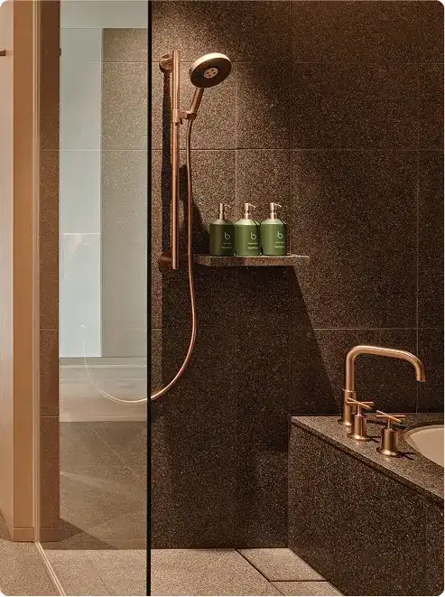 Elegant tub with gold-toned fixtures.
